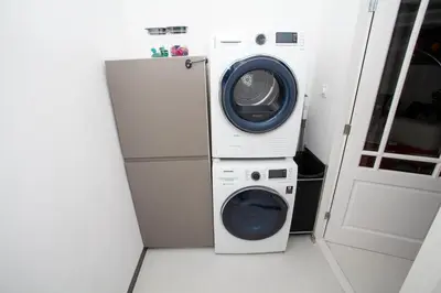 a washing machine and a dryer in a room at Modern Central Leiden Family Apt - Sleeps 6 and Baby in Leiden