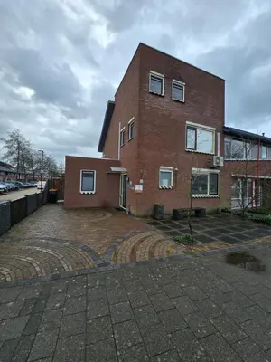 a brick building with a brick driveway in front of it at Studio Amnesia in Heerhugowaard