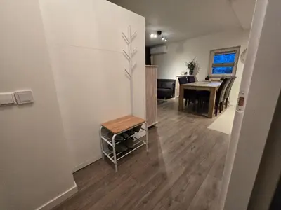 a living room and dining room with a table at Studio Amnesia in Heerhugowaard