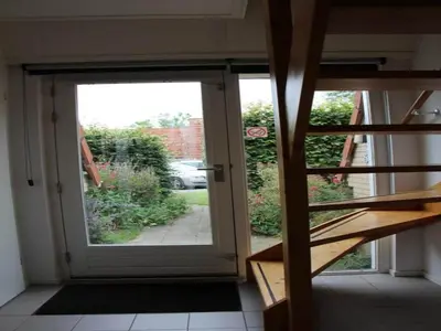 an open door with a view of a yard at Pretty holiday home in Burgerburg in Burgerbrug