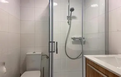 a bathroom with a shower with a toilet and a sink at Pet Friendly Home In Dirkshorn in Dirkshorn