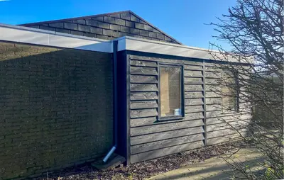 a building with a window on the side of it at Pet Friendly Home In Dirkshorn in Dirkshorn