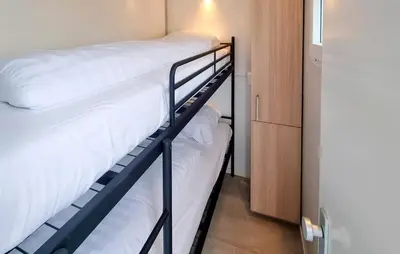 a couple of bunk beds in a small room at Havenlodge Amsterdam 1 in Amsterdam