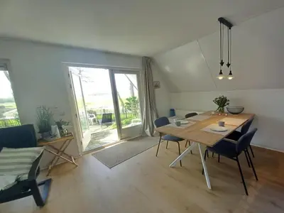 a dining room with a table and chairs in a room at Holiday home in Burgerbrug for family in Burgerbrug