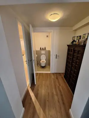 a small bathroom with a toilet in a room at Beautiful apartment close to sea Beach Life 51A in Noordwijk
