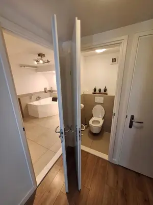 an open bathroom with a toilet and a sink at Beautiful apartment close to sea Beach Life 51A in Noordwijk