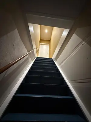 a staircase in a building with blue steps at cozy apartment in the centre of Gouda in Gouda