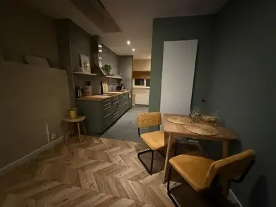 a kitchen with a table and chairs in a room at cozy apartment in the centre of Gouda in Gouda