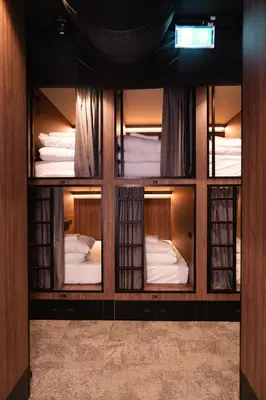 a room with four bunk beds in it at Cabins Hotel Amsterdam in Amsterdam