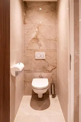 a small bathroom with a toilet and a sink at Cabins Hotel Amsterdam in Amsterdam