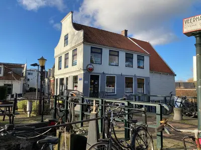 a white building with bikes parked in front of it at Villa335 boutique b&b in Amsterdam