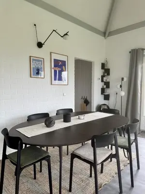 a dining room with a table and chairs at Bungalowpark de Horn - 128 in Dirkshorn
