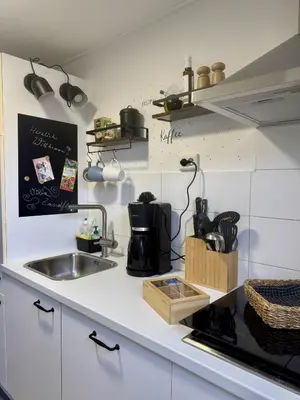 a kitchen with a sink and a counter top at Bungalowpark de Horn - 128 in Dirkshorn