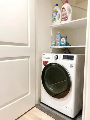 a washing machine in a kitchen next to a door at Spacious and Cozy House with Affordable Parking in Amsterdam
