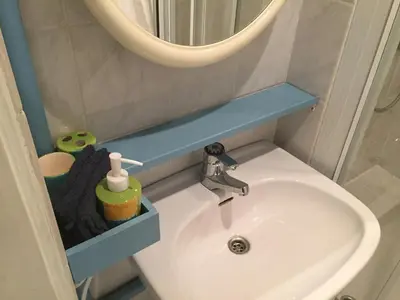 a bathroom with a sink and a mirror at Droomgaerd in Vlist