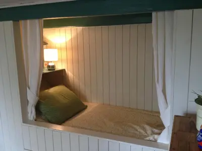 a room with a window with a bed in it at Droomgaerd in Vlist