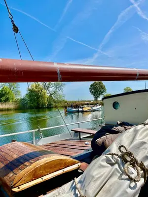 a boat deck with a view of a river at Ray's crew in Weesp