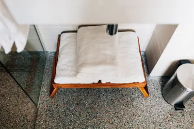a small stool sitting on the floor in a bathroom at Boutique B&B Bovien in Amsterdam
