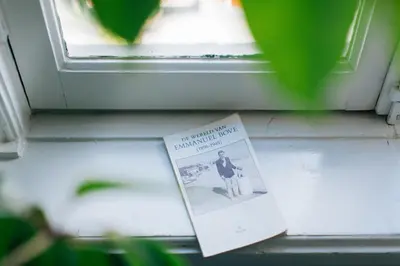 a book sitting on top of a window sill at Boutique B&B Bovien in Amsterdam
