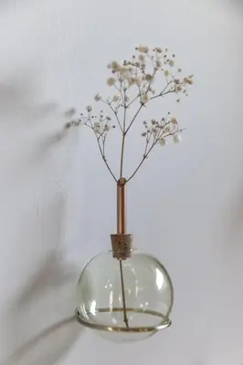 a clear glass vase with a plant in it at Palm Tree in Bergen