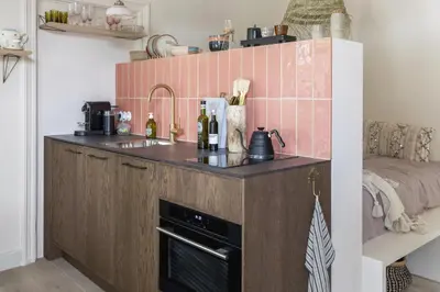 a small kitchen with a sink and a counter at Magnolia Tree in Bergen
