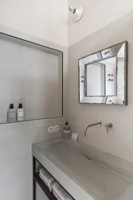 a bathroom with a tub and a mirror at Magnolia Tree in Bergen