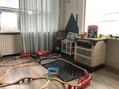 a childs room with a play room with a roller coaster at Family beach house in Egmond aan Zee