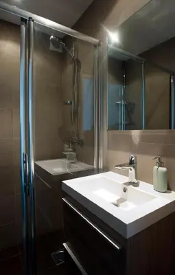 a bathroom with a sink and a shower at bij Miep in Egmond aan Zee