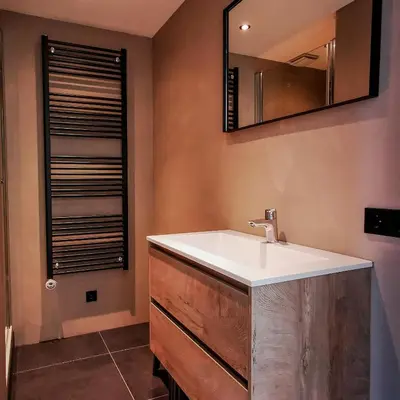 a bathroom with a sink and a mirror at de Vuurtoren in Egmond aan Zee