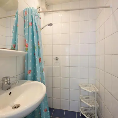 a bathroom with a sink and a shower at de Vloedlijn in Egmond aan Zee