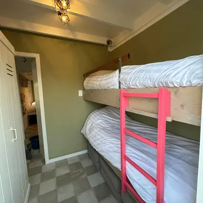 a bedroom with two bunk beds in a room at Nice chalet near Reeuwijkse plassen in Reeuwijk