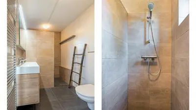 a bathroom with a shower and a toilet at Klavertje vier in Schoorl