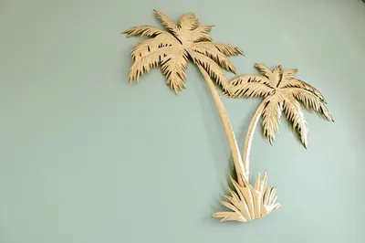 two palm trees on a blue background at Zonnehoek 75 in Egmond aan Zee