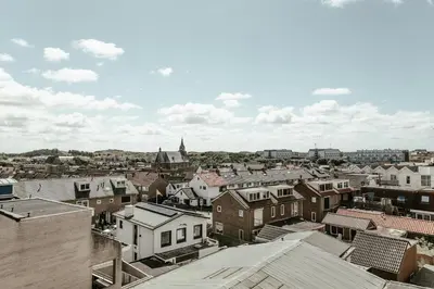 an aerial view of a city with buildings at Zonnehoek 75 in Egmond aan Zee