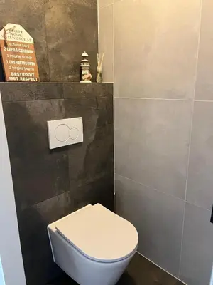 a bathroom with a white toilet in a room at The Lighthouse in Egmond aan Zee
