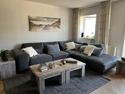a living room with a couch and a coffee table at The Lighthouse in Egmond aan Zee