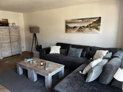 a living room with a couch and a coffee table at The Lighthouse in Egmond aan Zee