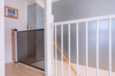 a staircase in a home with white walls at Fay in Egmond aan Zee