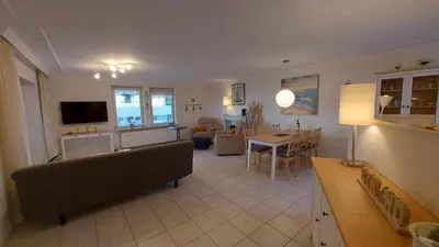 a living room with a couch and a table at Atlantis 14c in Egmond aan Zee