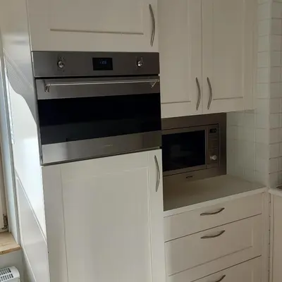 a kitchen with a stove and a microwave at Atlantis 14c in Egmond aan Zee