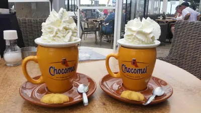 two cups of coffee with whipped cream on a table at Atlantis 14c in Egmond aan Zee