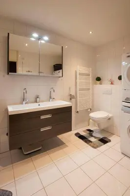 a bathroom with a sink and a toilet at Zonnehoek 63 in Egmond aan Zee