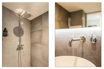 a bathroom with a shower and a sink at Appartementen De Wilg - Adults only in Noordwijk aan Zee
