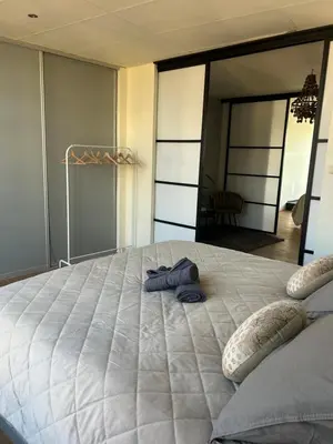 a large bed with two pillows on top of it at Saya Loft in Amersfoort