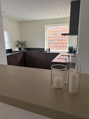 a kitchen with a counter with two candles on it at Saya Loft in Amersfoort