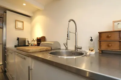 a kitchen with a sink and a counter top at Gwendolynn lovely holiday home in Bergen