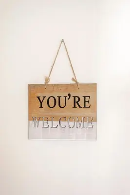 a sign that says youre welcome hanging on a wall at Beach and Dunes Studio - Free Parking in Zandvoort
