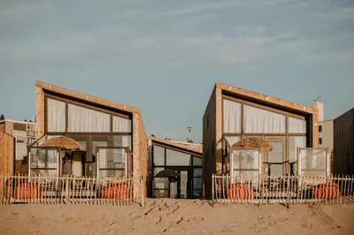 a building with large windows in the desert at Venti Beach Houses in Zandvoort