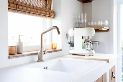 a kitchen sink with a mixer on top of it at By Tons Huisje inclusief twee fietsen in Zegveld