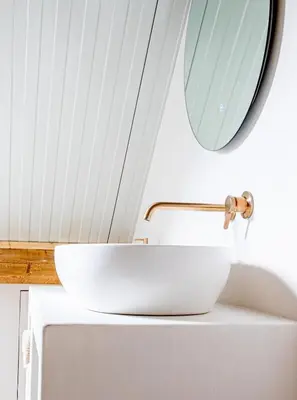 a bathroom with a white sink and a mirror at By Tons Huisje inclusief twee fietsen in Zegveld